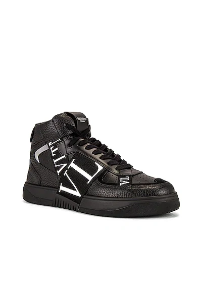 Shop Valentino Vl7n Mid Top Sneakers In Black