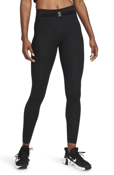 Shop Nike Dri-fit One Luxe Buckle Mid Rise Leggings In Black/ Clear
