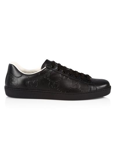 Shop Gucci New Ace Gg Embossed Sneakers In Black