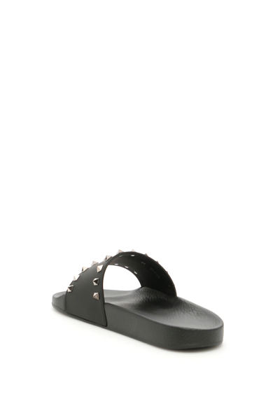 Shop Valentino Rockstud Rubber Slides In Black