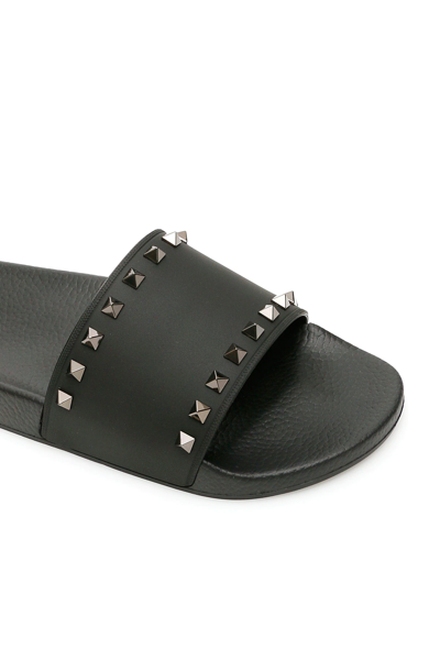 Shop Valentino Rockstud Rubber Slides In Black