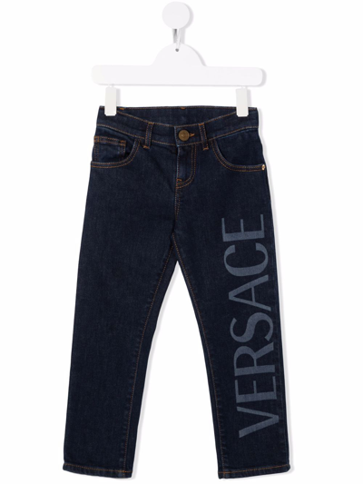 Shop Versace Logo Print Jeans In Blue