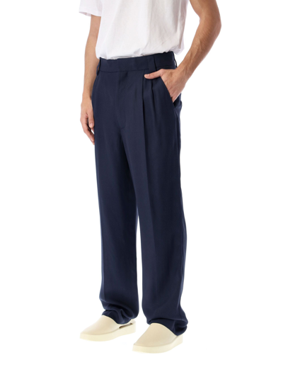 Shop Fear Of God Pleated Tapered Leg Trousers In Navy