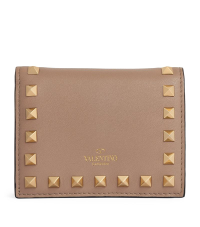 Shop Valentino Garavani Grained Leather Rockstud Flap Wallet In Pink