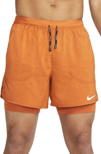 Shop Nike Dri-fit Flex Stride Pocket 2-in-1 Running Shorts In Sport Spice/ Sport Spice