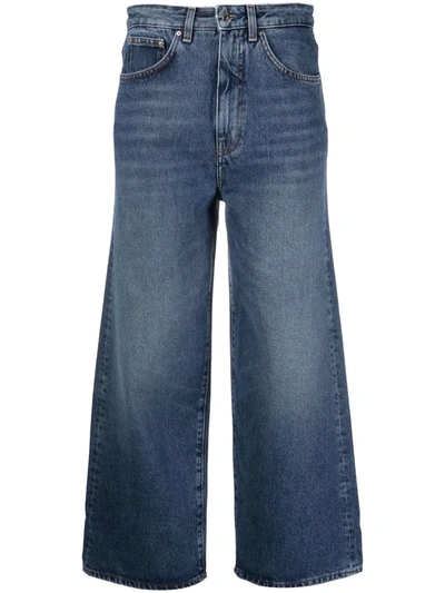 Shop Totême Organic Cotton Cropped Flared Jeans In Blue