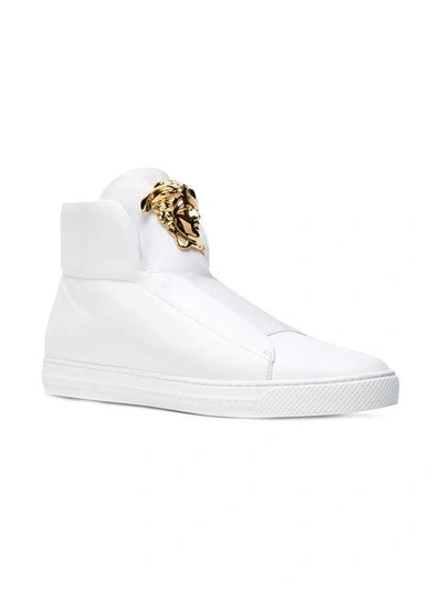 Shop Versace Medusa Hi-top Sneakers In D01o White/gold