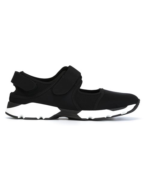 black trainers with velcro straps