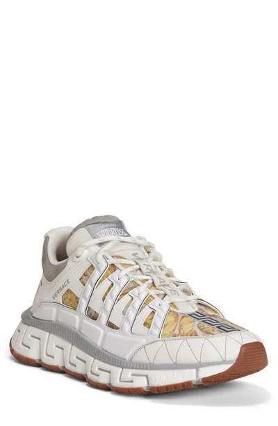 Shop Versace Trigreca Low Top Sneaker In White Grey Gold