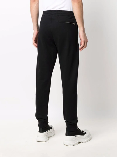 Shop Alexander Mcqueen Logo Jogger Trousers In Black