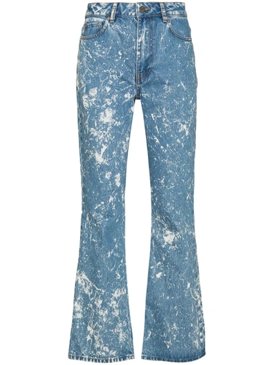 Shop Ganni Flared Acid Wash Jeans In Blue