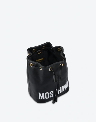 Shop Moschino Print Logo Bucket Bag In Black