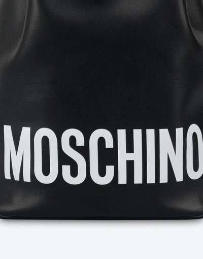 Shop Moschino Print Logo Bucket Bag In Black