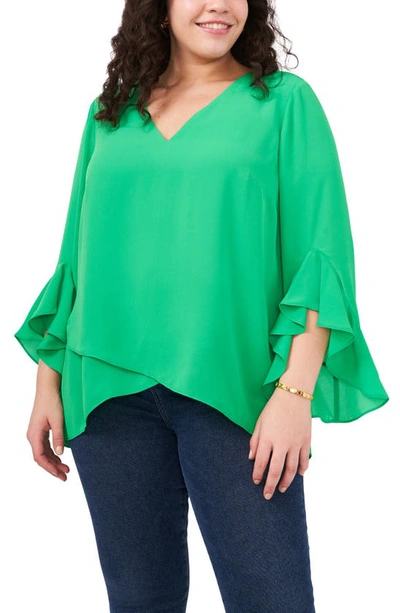 Shop Vince Camuto Flutter Sleeve Crossover Georgette Tunic Top In Vivid Green