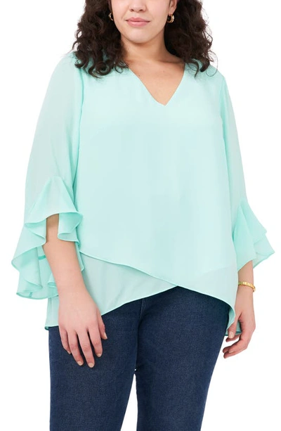 Shop Vince Camuto Flutter Sleeve Crossover Georgette Tunic Top In Light Blue