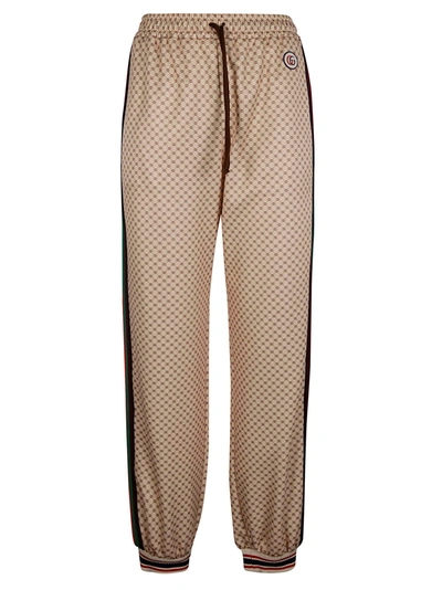 Shop Gucci Web Stripe Side Logo Patched Track Pants In Beige/cammello