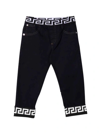 Shop Versace Greca Newborn Jeans Young In Blu E Nero