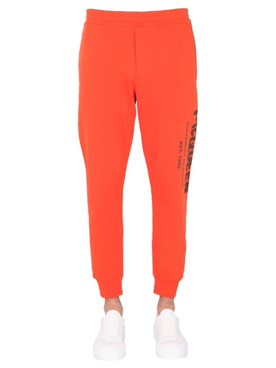 Shop Alexander Mcqueen Jogging Pants In Orange/khaki