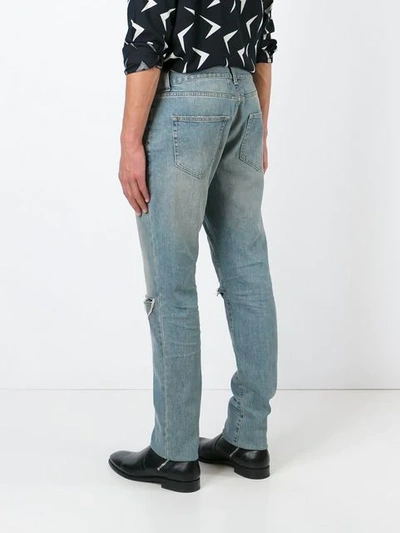 Shop Saint Laurent Distressed Slim Jeans In Blue