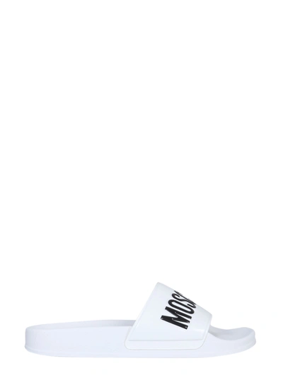 Shop Moschino Rubber Slide Sandals In Bianco/nero