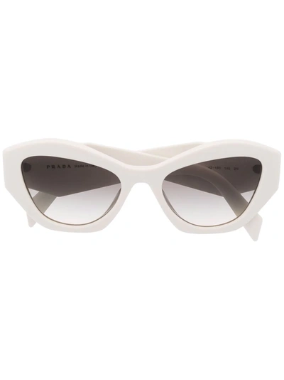 Shop Prada Oval Frame Sunglasses In White