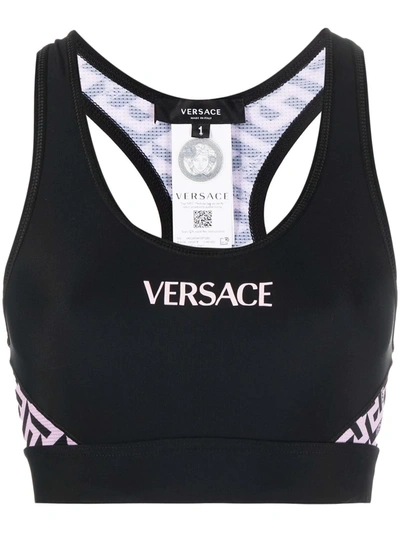 Shop Versace La Greca Print Sports Bra In Schwarz