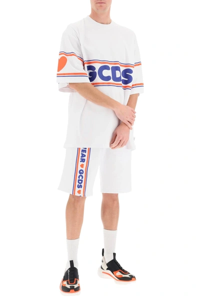 Shop Gcds Short Sweatpants With Cute Logo Tape In White,blue,orange