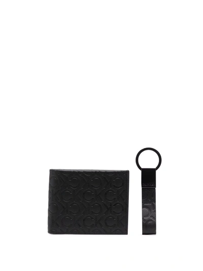 Shop Calvin Klein Embossed Logo Keyfob Wallet In Black