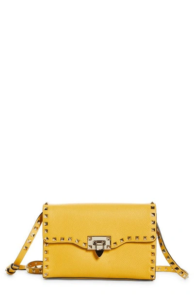 Shop Valentino Small Rockstud Leather Shoulder Bag In Golden Yellow