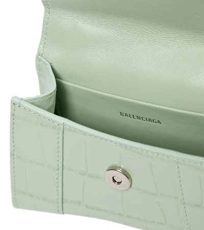 Shop Balenciaga Hourglass Mini Leather Crossbody Bag In Light Green