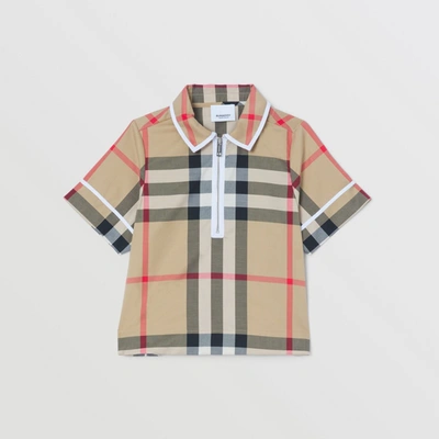 Shop Burberry Childrens Exaggerated Check Cotton Zip-front Polo Shirt In Archive Beige