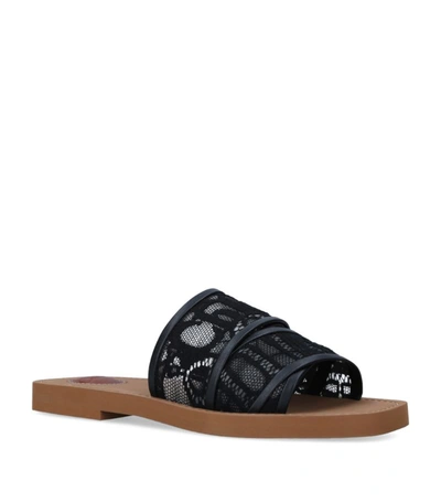 Shop Chloé Lace Woody Slides In Black