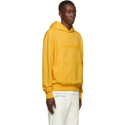 Shop Adidas X Humanrace By Pharrell Williams Ssense Exclusive Humanrace Tonal Logo Hoodie In Bold Gold 005a