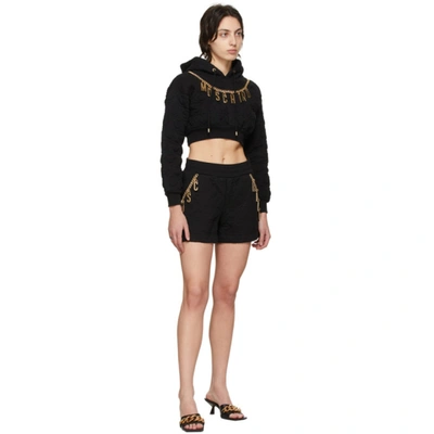 Shop Moschino Black Smiley© Edition Charm Crop Hoodie In A0555 Black