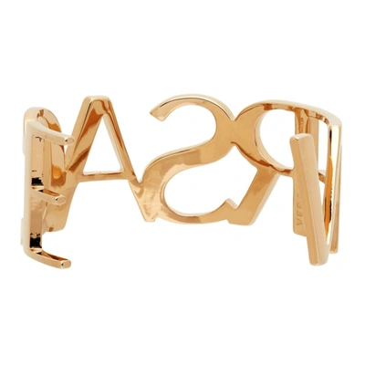 Shop Versace Gold Logo Cuff Bracelet In 3j000 Gold