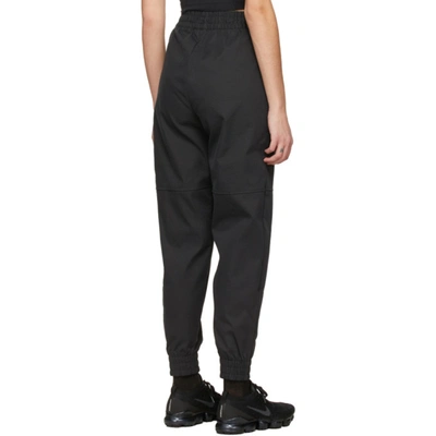 Shop Nike Black Woven Sportswear Swoosh Lounge Pants In 010 Black