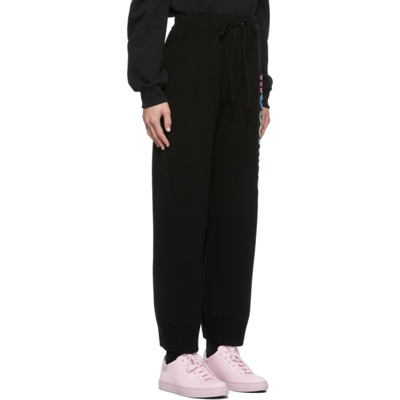 Shop Moschino Black Painted Logo Lounge Pants In A1555 Black