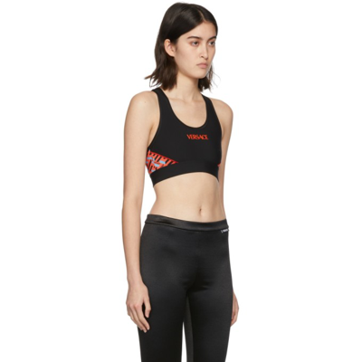 Shop Versace Black & Orange Logo Sports Bra In 5b250 Black+orange