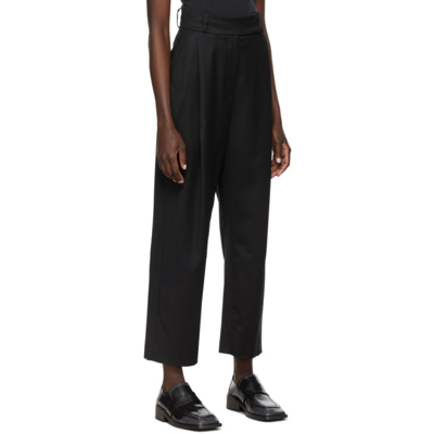 Shop Totême Deep Pleat Trousers In 200 Black