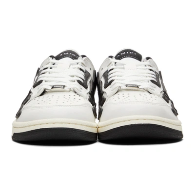 Shop Amiri Skel Top Low Sneakers In White / Black