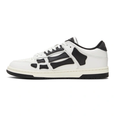 Shop Amiri Skel Top Low Sneakers In White / Black