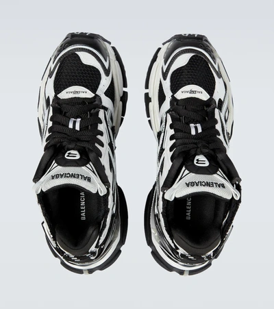 Shop Balenciaga Runner Sneakers In White/black