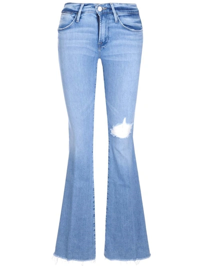 Shop Frame Distressed High Waisted Flared Jeans In Blue