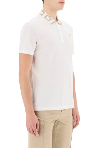 Shop Versace Greca Patterned Collar Polo In White,gold