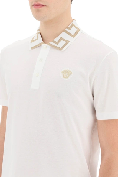 Shop Versace Greca Patterned Collar Polo In White,gold