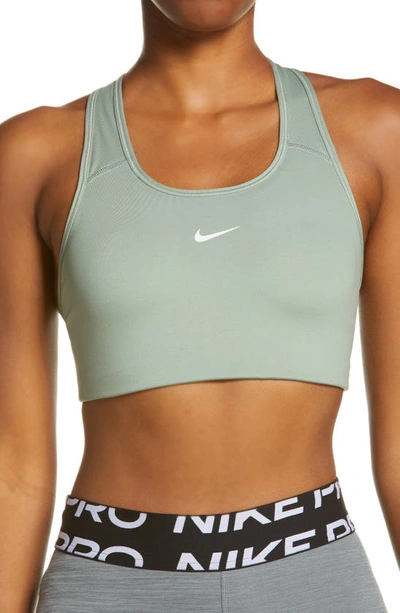 Shop Nike Swoosh Dri-fit Racerback Sports Bra In Jade Smoke/ White