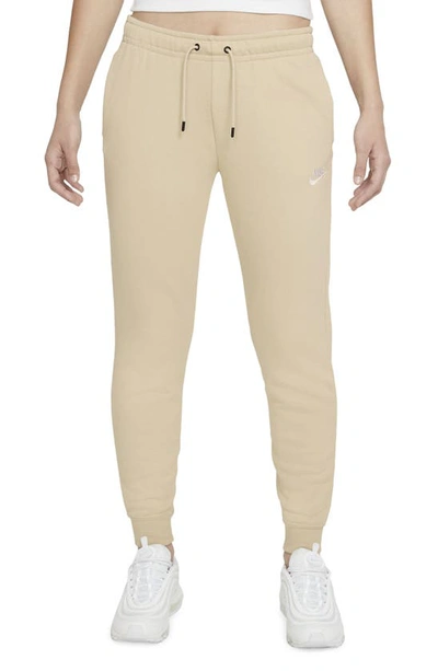 Shop Nike Sportswear Essential Fleece Pants In Rattan/ White
