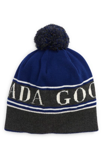Shop Canada Goose Pom Merino Wool Blend Beanie In Northern Night-nuit Nordique