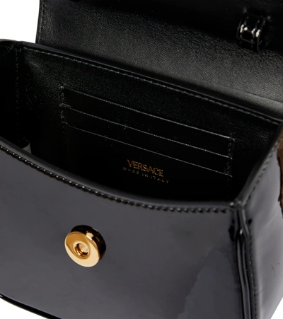 Shop Versace La Medusa Mini Leather Tote In Black- Gold
