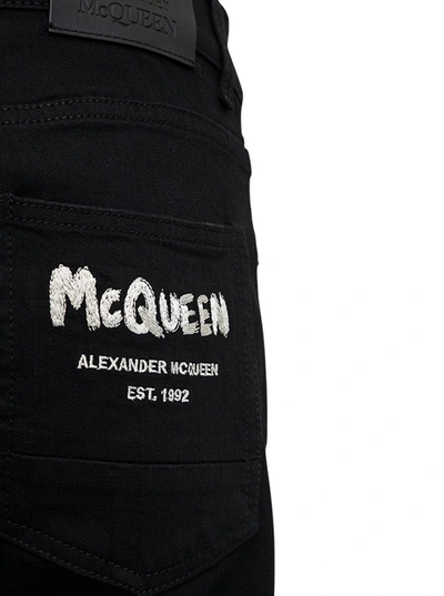 Shop Alexander Mcqueen Black Denim Jeans With Graffiti Print